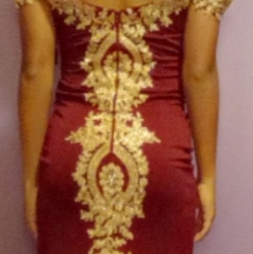 Burgundy and gold prom dress with diamonds in a medium
